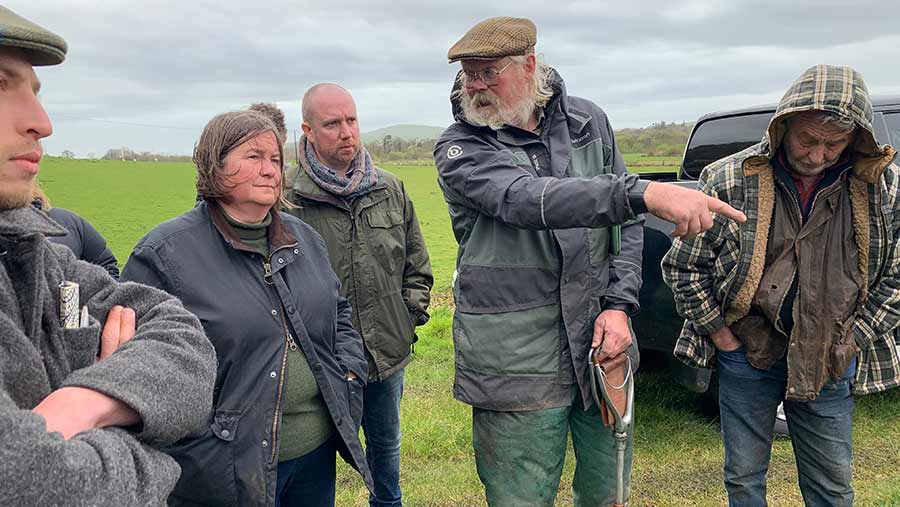 Clare Pillman (second left) and Mabon ap Gwynfor (third left) with farmers © Farmers' Union of Wales