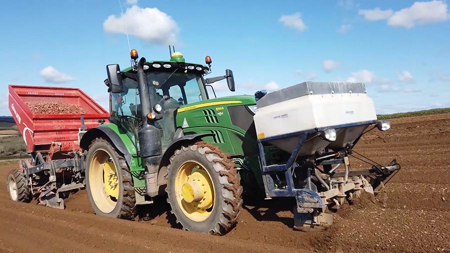 Tractor with mounted potato planter