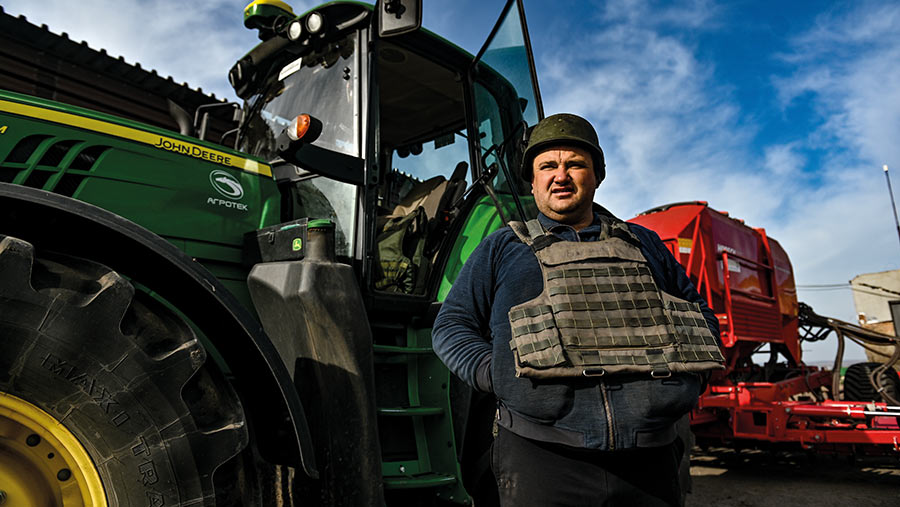 Ukrainian farmer in bulletproof vest