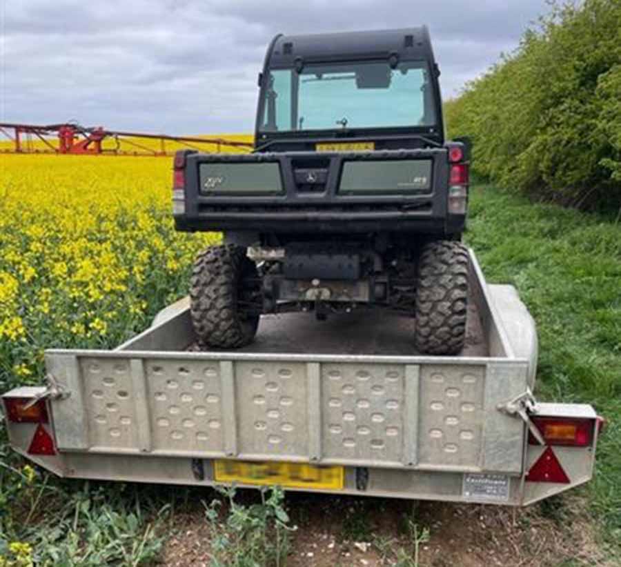 Stolen trailer and ATV in field