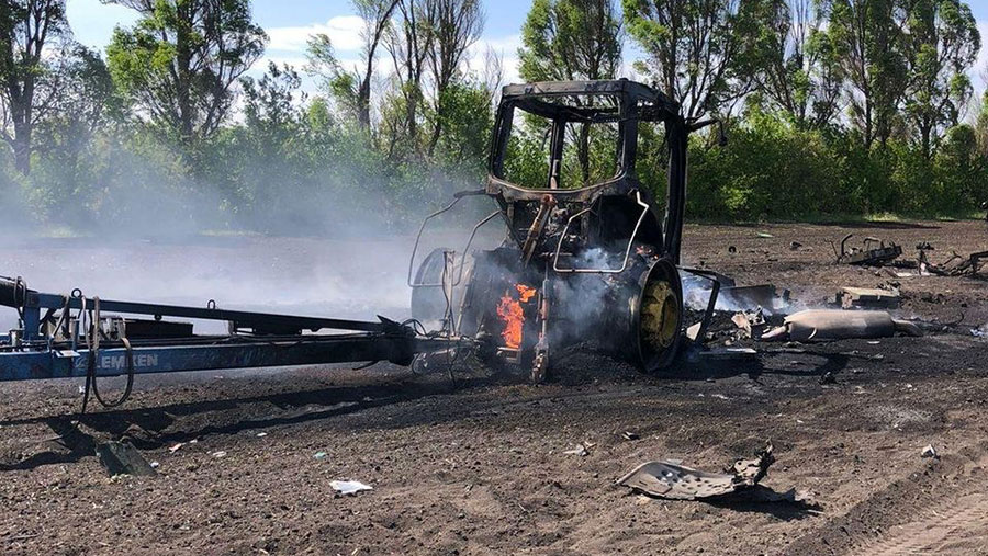 The burned out remains of the tractor after the missile strike