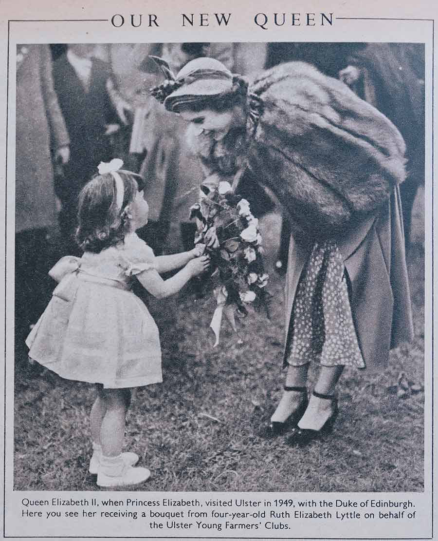 Queen Elizabeth and child with bouquet