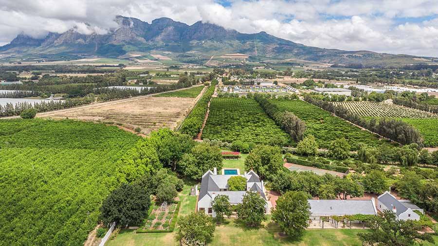 Aerial view of land with buildings