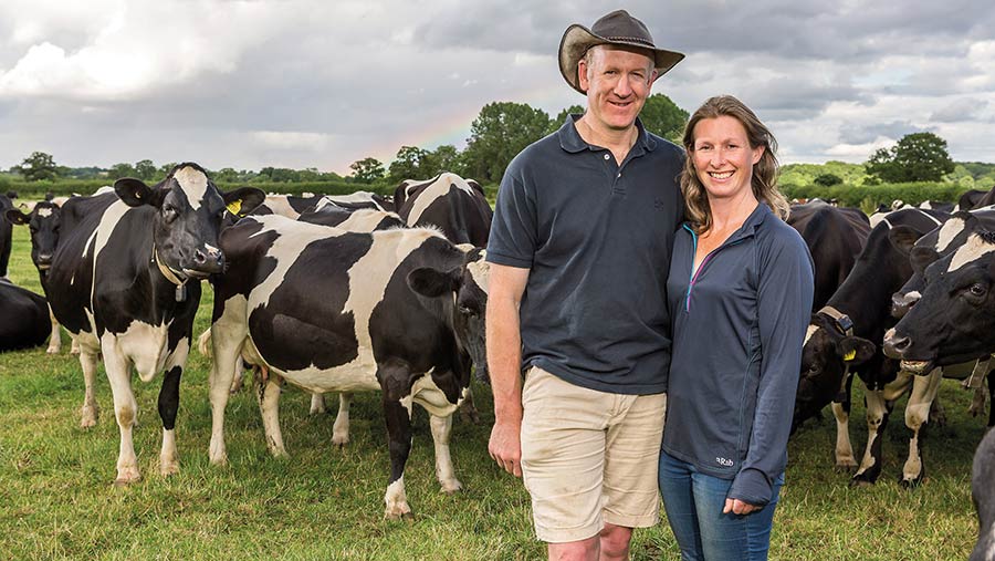 Tim and Louise Downes with their dairy herd