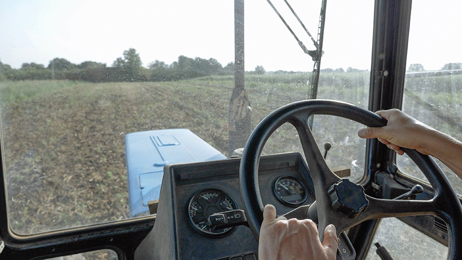 tractor cab with man driving