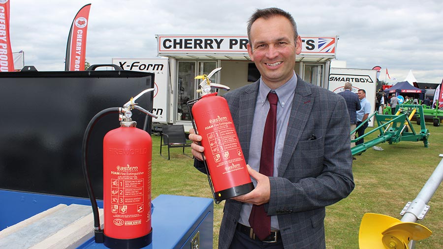 Ian Fenton of Cherry Products with examples of the Eastern high-density foam fire extinguishers