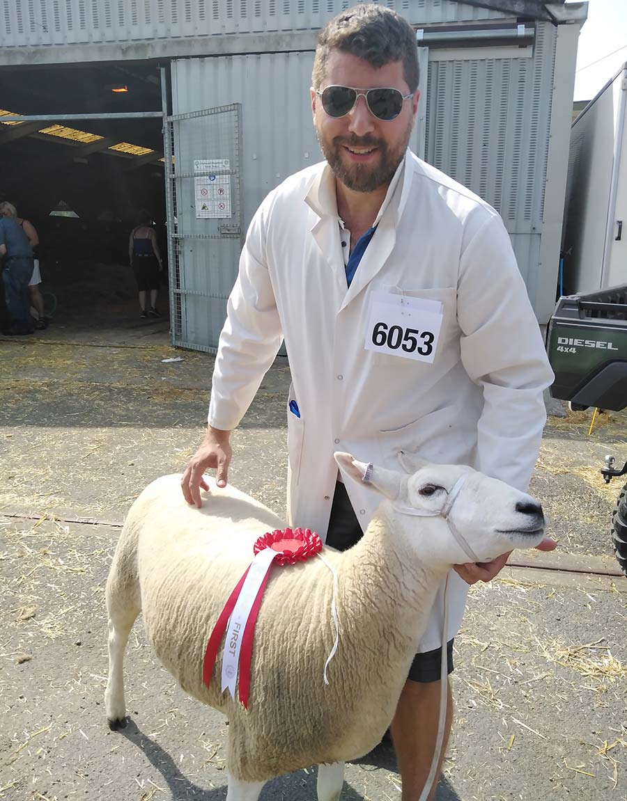 Sheep farmer Adam Daniel with one of his winning Lleyn sheep