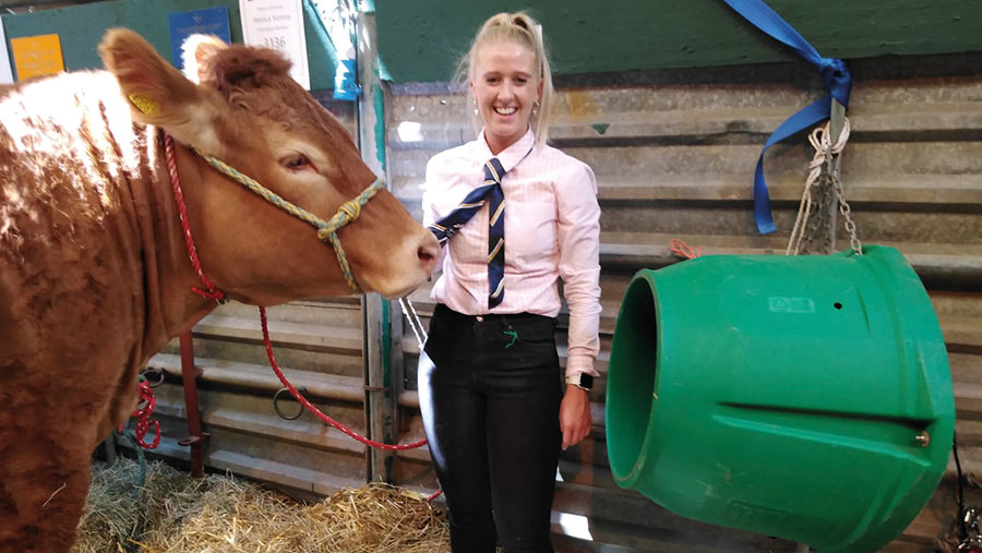 Jessica Simms with a cow