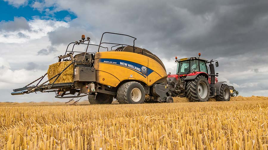 Baling under cloudy sky