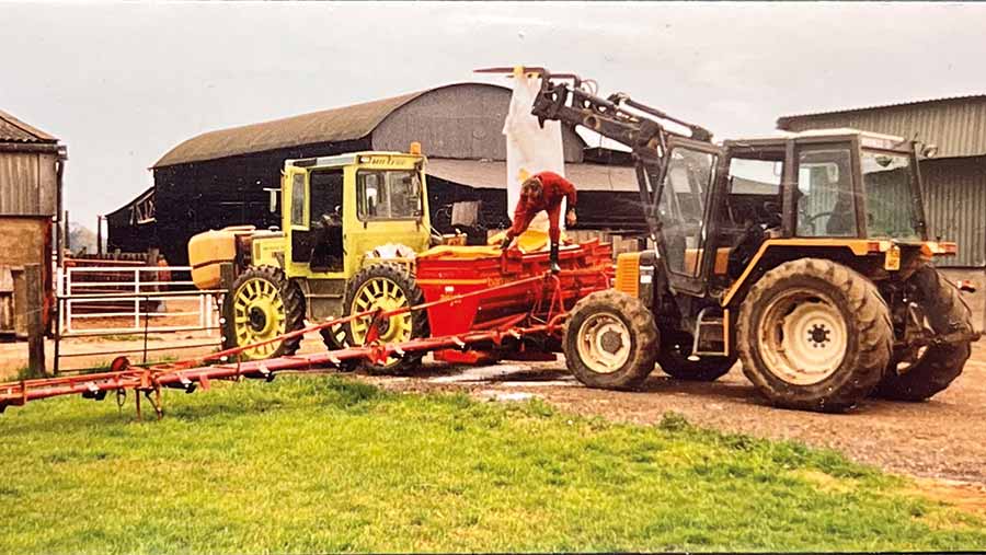 Old photo of tractors in a farmyard