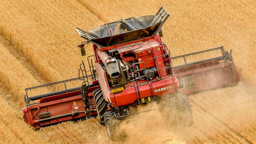 Combine harvester and old Fergie set off on separate end-to-end