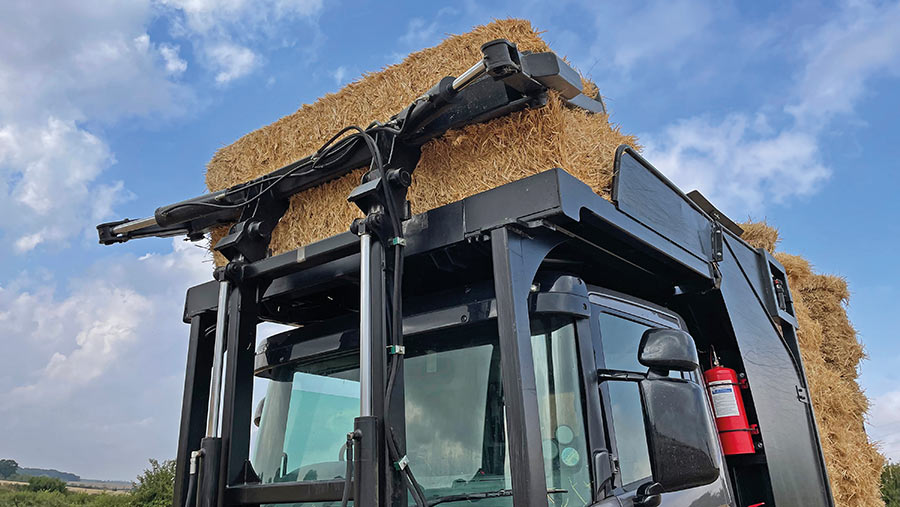  Bale loading arm