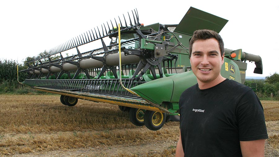 Tom Carlisle with the John Deere S790i and 735D draper header