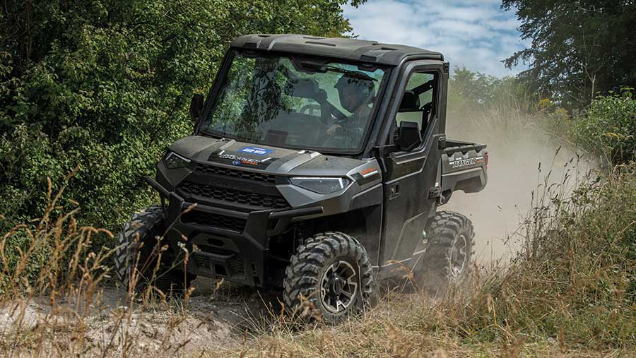 UTV driving on dusty ground