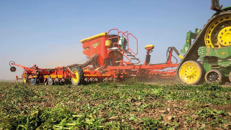 Tractor drilling into a cover crop