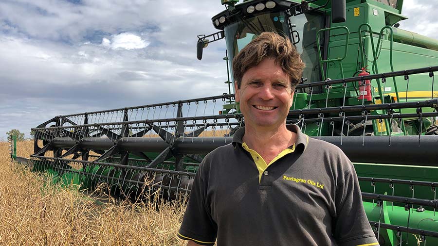 Man standing in front of a combine