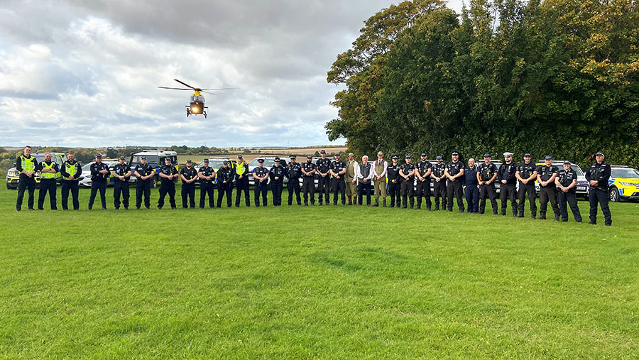 Police officers with helicopter