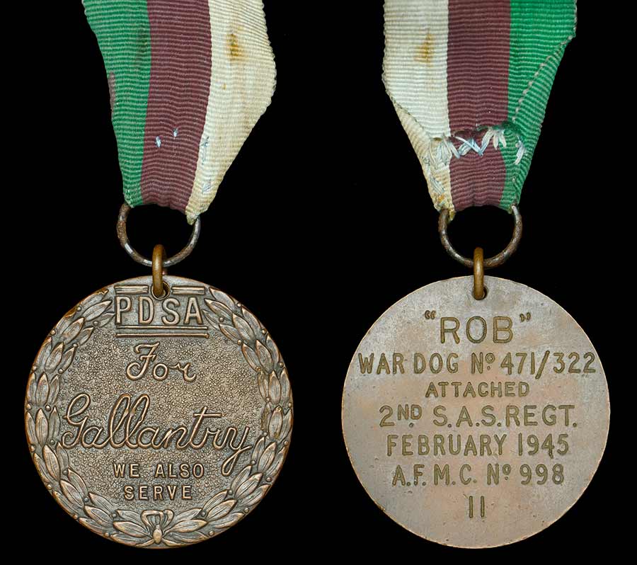 Front and back of bronze medal with silk ribbon