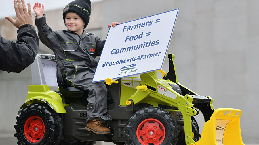 Alex Rennie age 3 from Aberdeenshire takes part in a NFU Scotland Rally outside the Scottish Parliament in support of farming, crofting and food production © Alamy Stock Photo