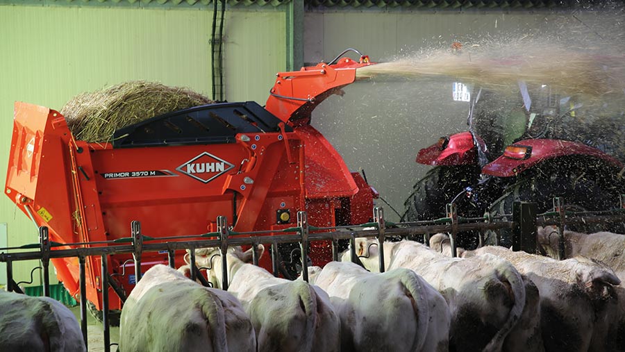 Bale chopper feeding sheep