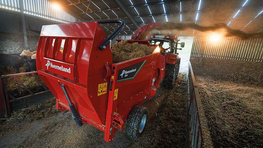 Bale chopper working in a shed