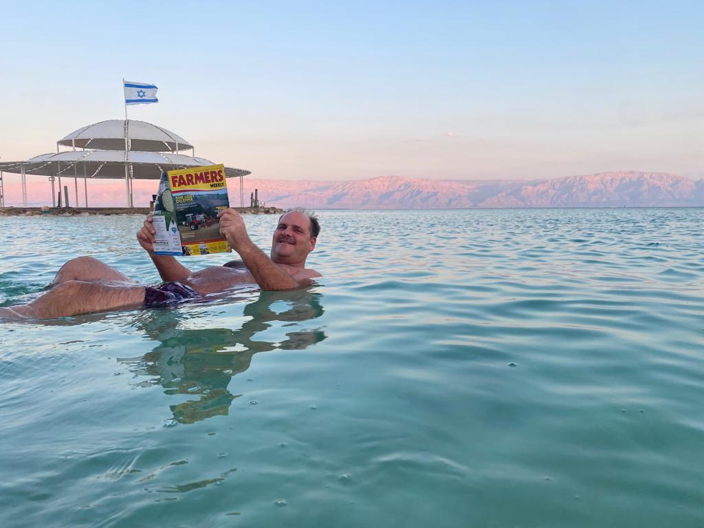 Robert Borrill floating in the Dead Sea with his copy of Farmers Weekly © Mark Williams