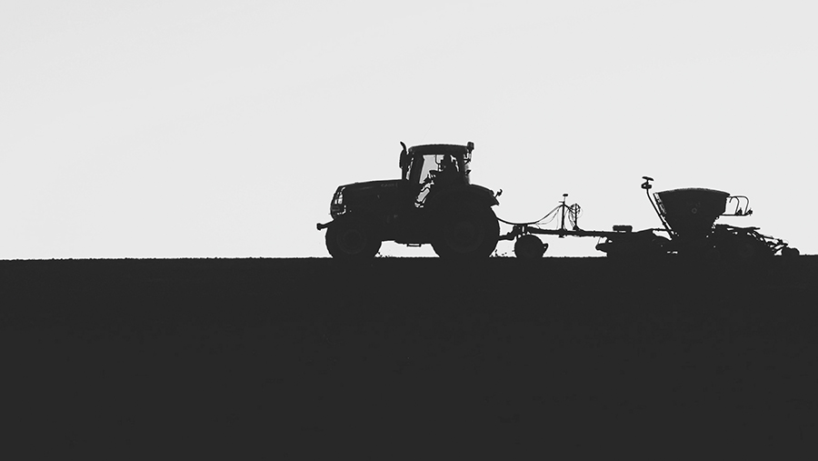 Tractor in field silhouette