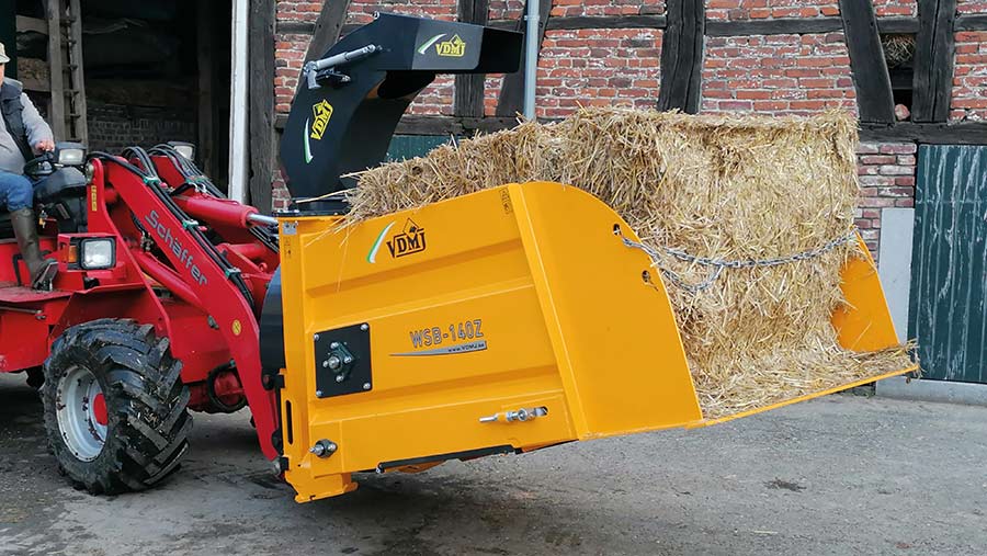 Tractor mounted bale spreader