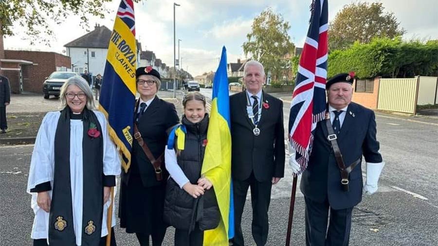 Katya with vicar and British Legion chairman and two bearers and flags