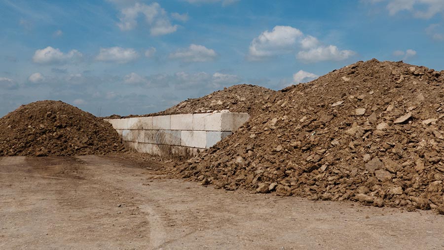 Heap of chicken manure on concrete