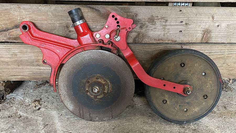 Disc and press wheel assembly removed from drill