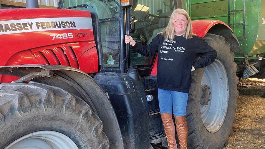 Emma Lander standing next to a tractor