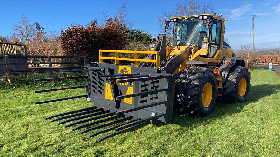 Loader with folded silage forks