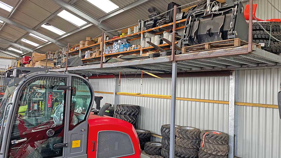 Spare parts on rack above HZM telehandler