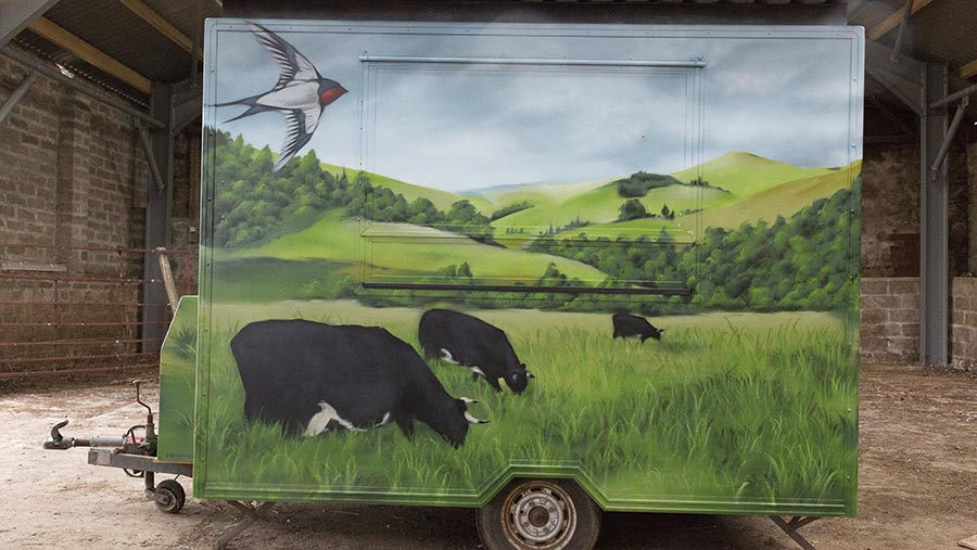 Burger van painted with scene of cattle grazing