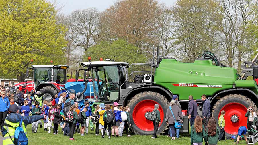 Schoolchildren and farm machinery