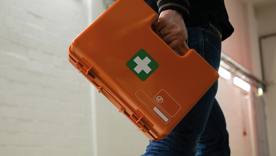 Man carrying first aid box
