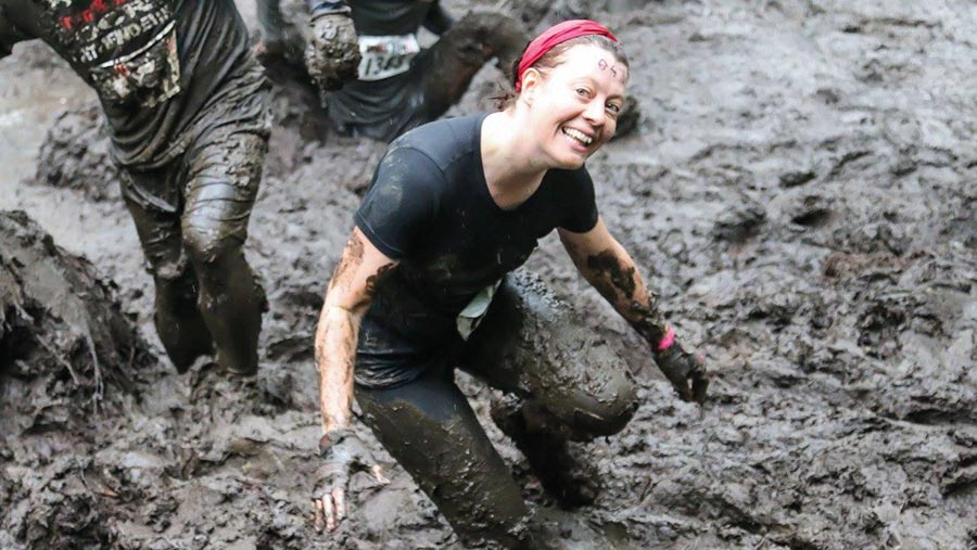 woman running in mud