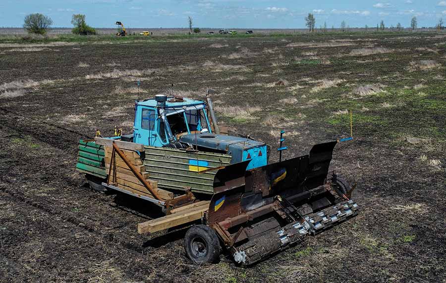 Old tractor with armour plating welded on