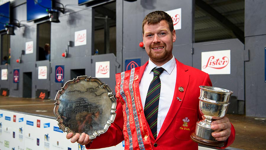 Machine-shearing champion Gwion Evans holds his awards     