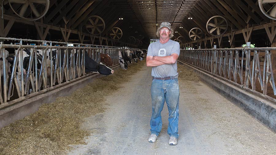  John Van Dungen in cow shed