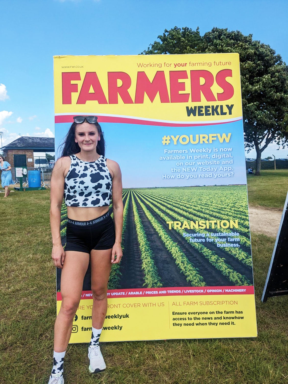 Suzanne Borrows with a poster of Farmers Weekly magazine
