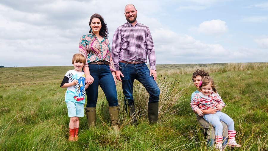 David and Cora Cooper with their children stood on grass