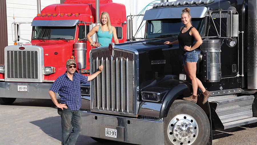 Mike Faulkner and his daughters Georgie and Emma with the Peterbilt (left) and Kenworth © Andrew Faulkner