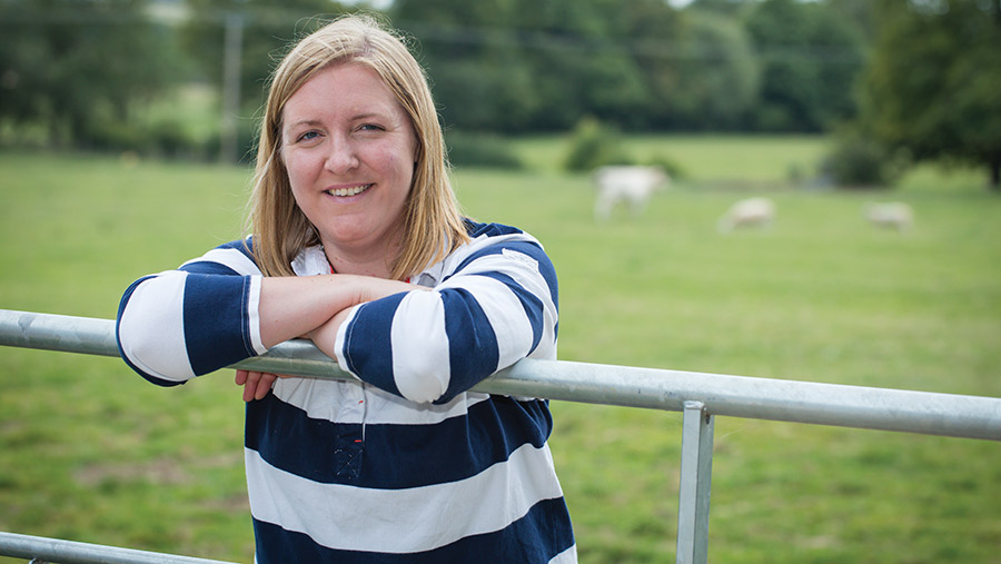 Milly Fyfe standing by fence