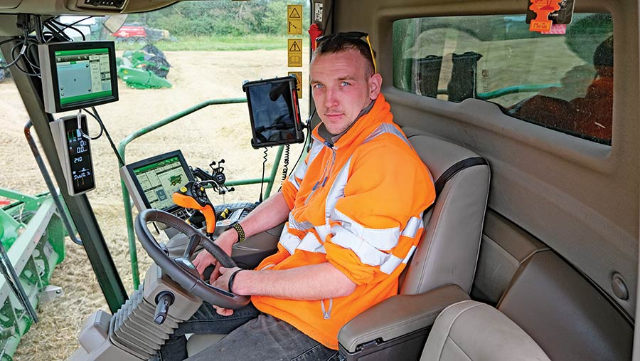 Man in the cab of a combine