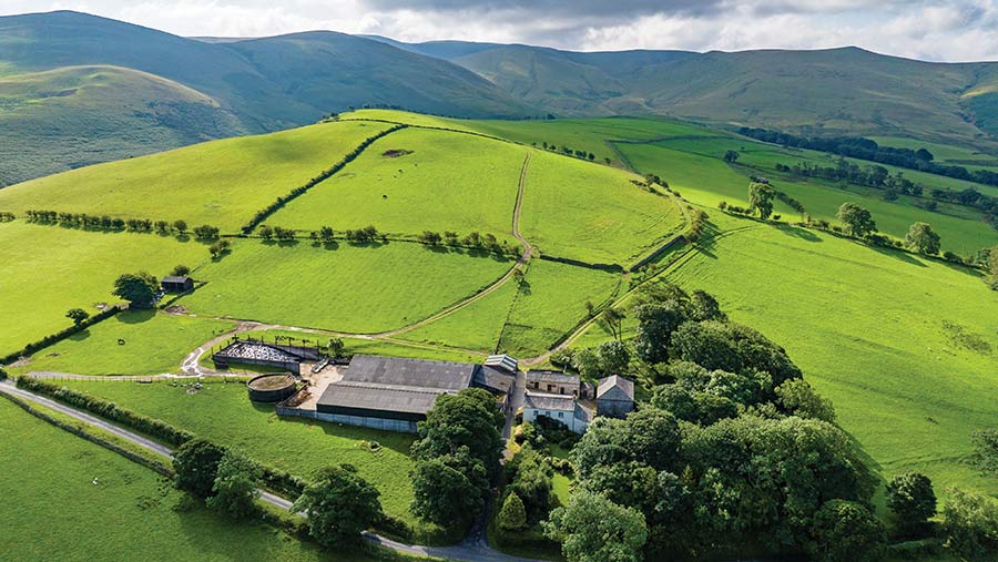 Aerial view of farmland with buildings