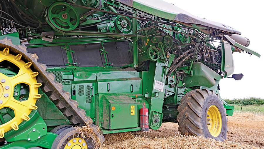 Side view of combine with panel removed