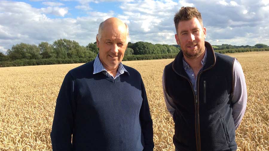 Father and son team, Rob and Peter Barlow standing in a wheat field