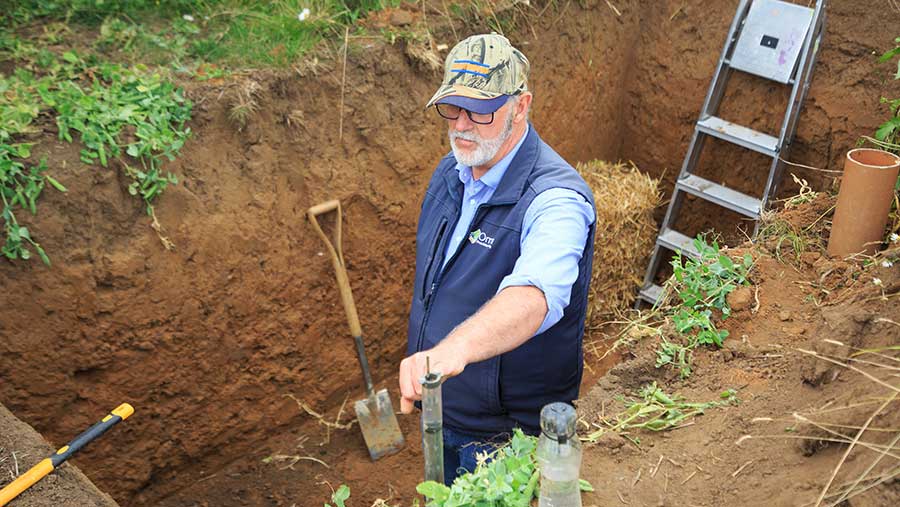 Man in soil pit